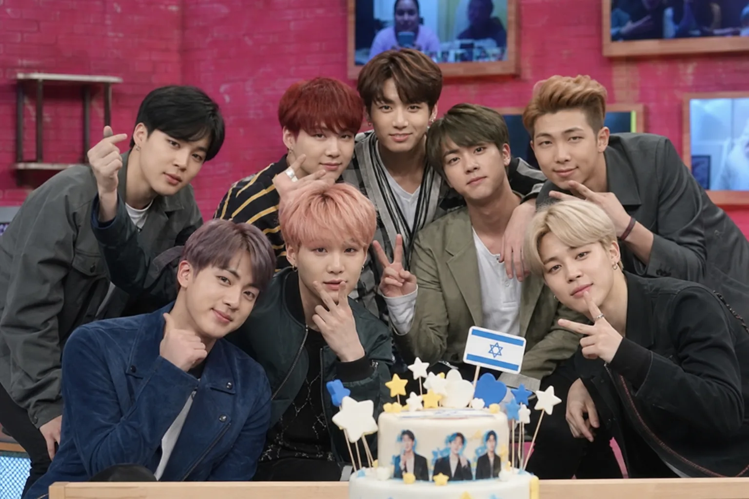 AI editorial image showing a K-pop studio broadcast prop becoming the focus of online scrutiny
