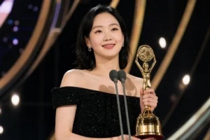 Elegant Korean streaming awards ceremony stage with gold lighting