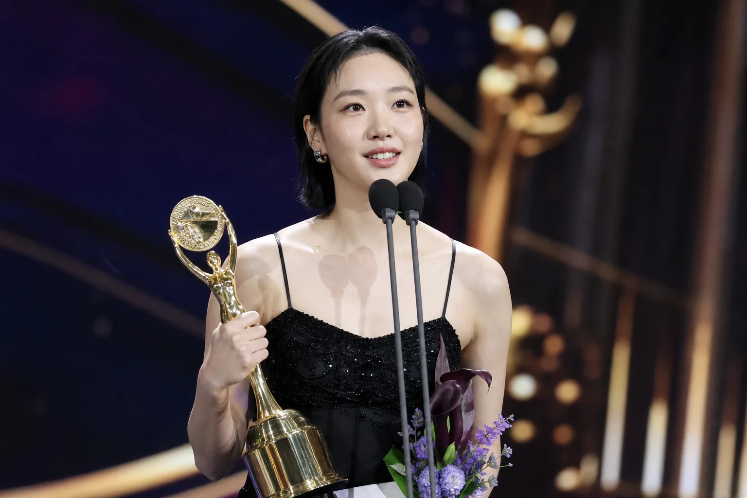 Korean drama awards trophy displayed under stage lights