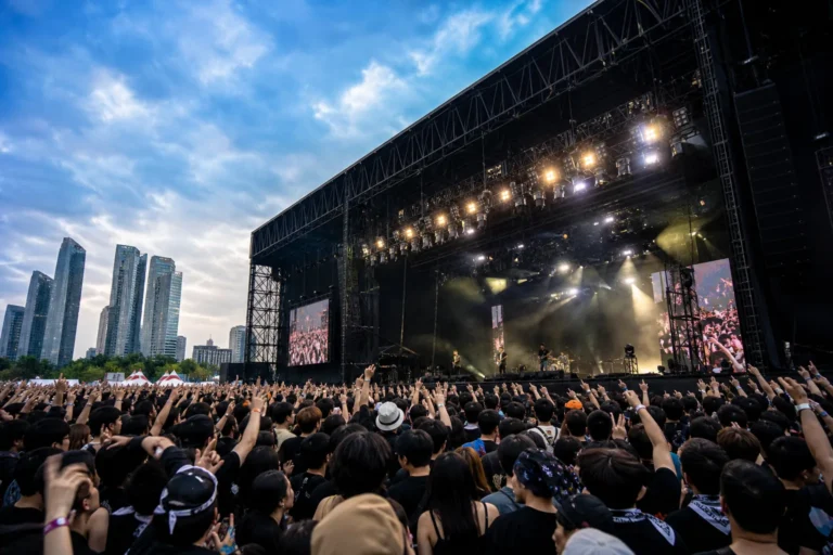 Crowd gathered at an outdoor rock music festival in Songdo