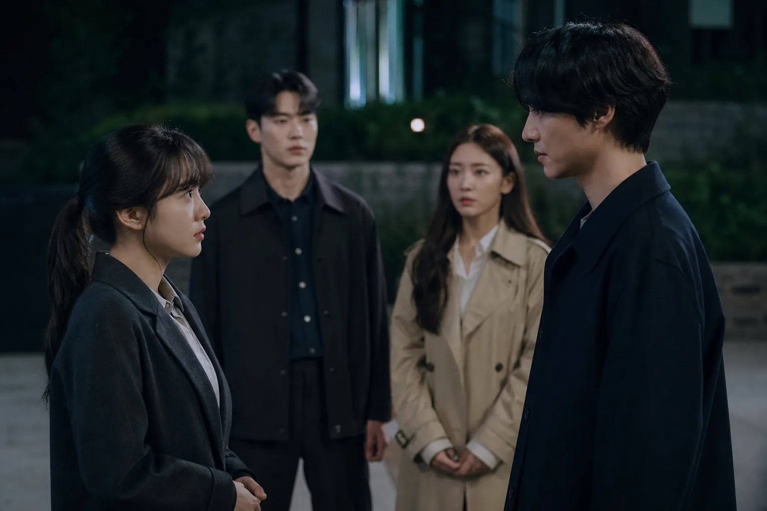 Four people meeting awkwardly in a dramatic evening setting