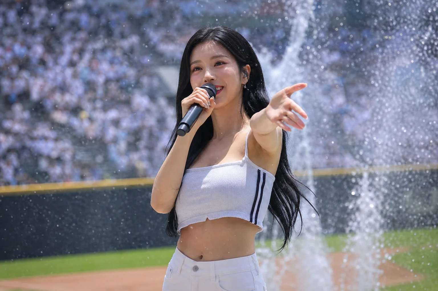 Summer concert-style water show for baseball fans at an outdoor stadium
