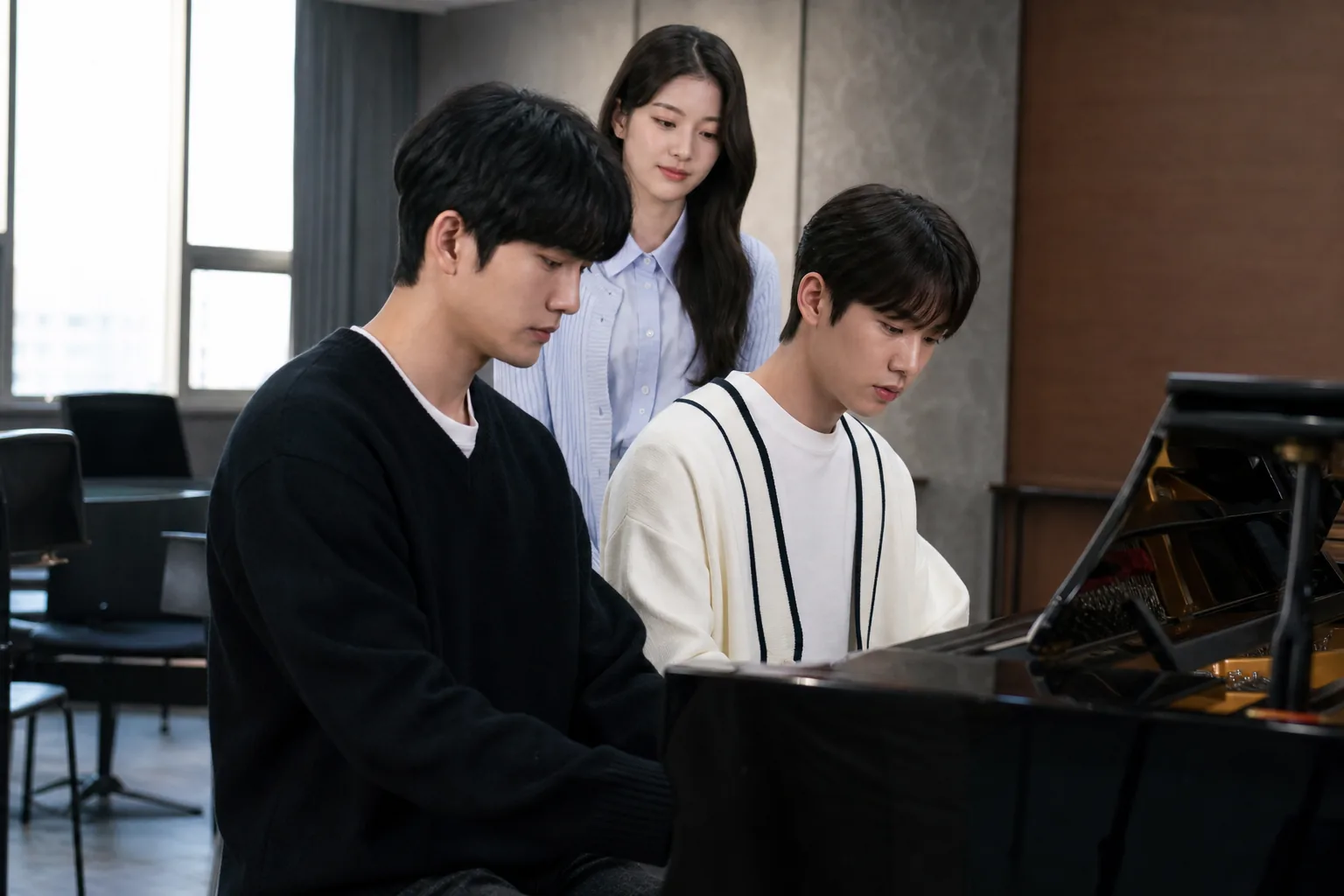 Classical music students walking through an arts school campus with instrument cases