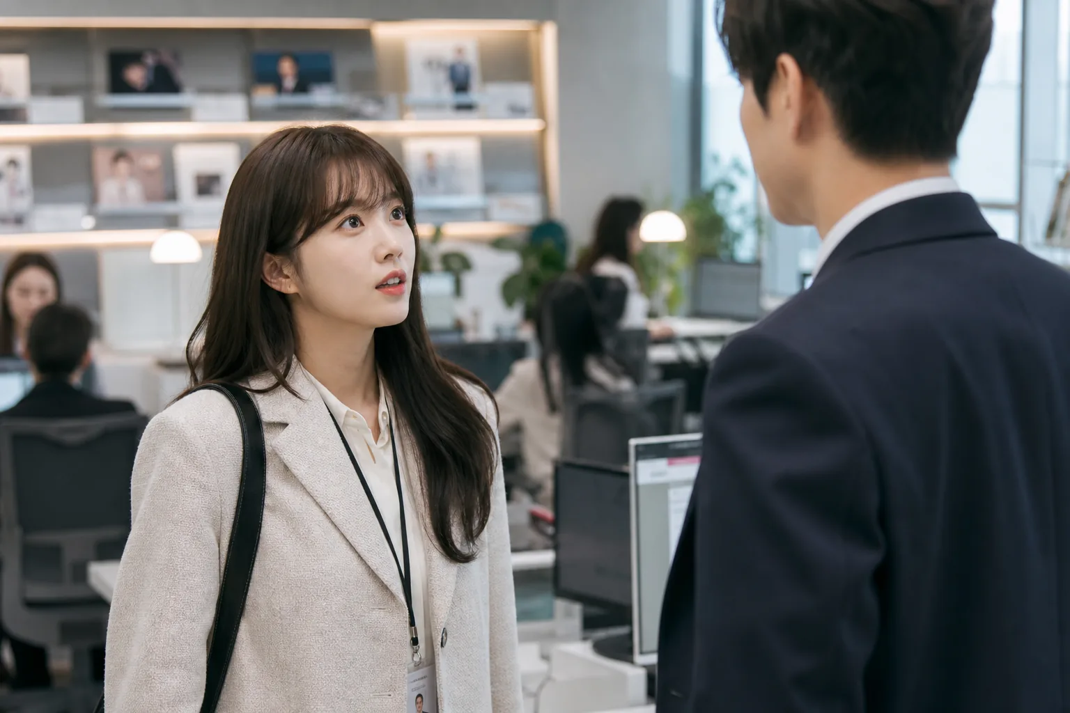 Korean drama heroine arriving for her first day at a modern entertainment company office