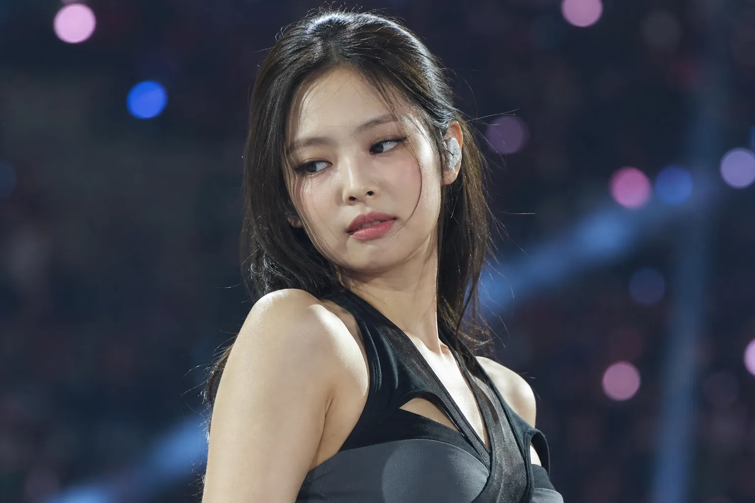 Editorial image of a K-pop artist performing at an outdoor summer music festival