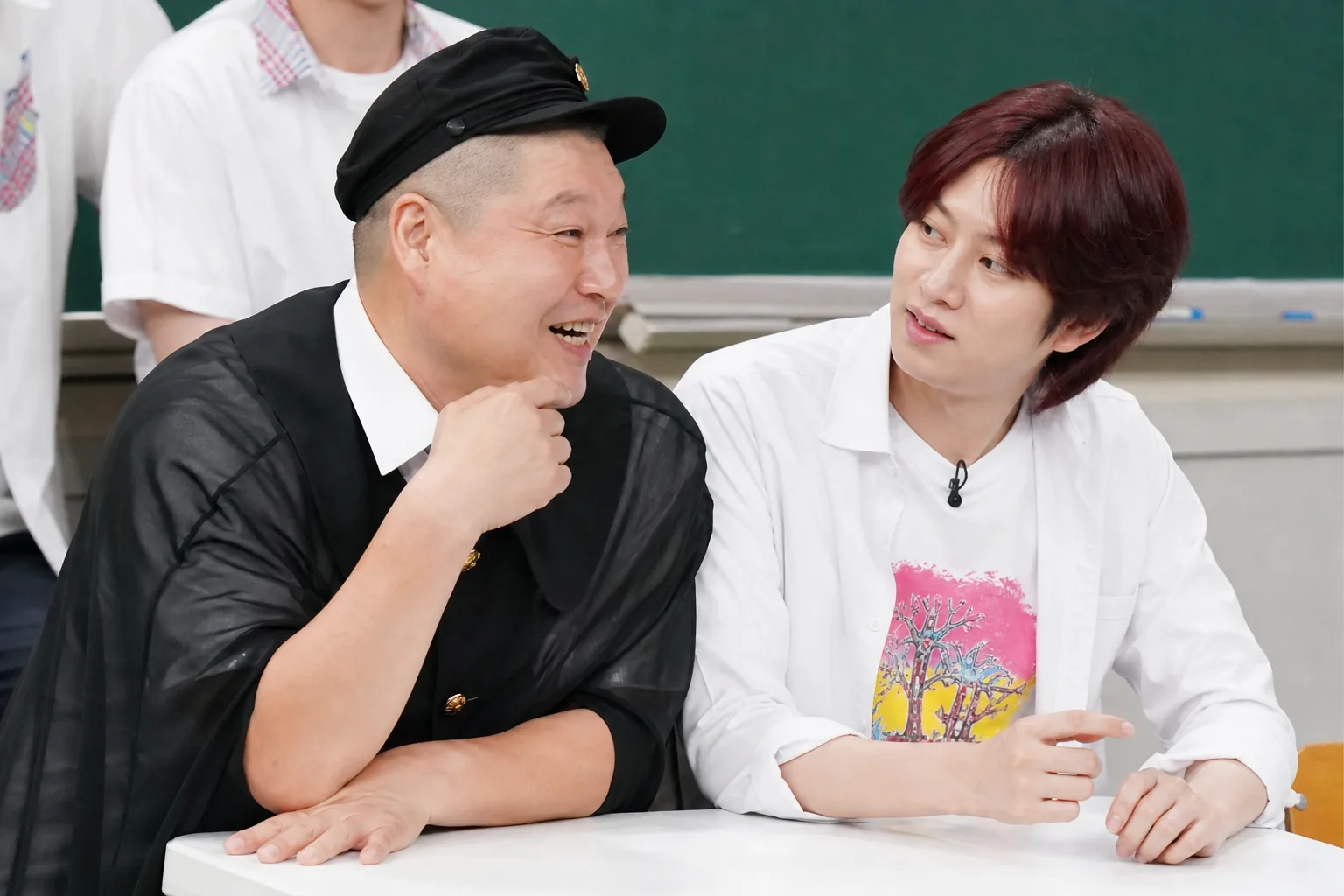 Editorial visualization of a television studio team preparing for a Korean variety program