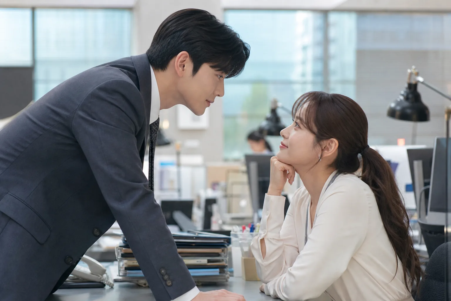 Korean drama production team reviewing a romantic office scene