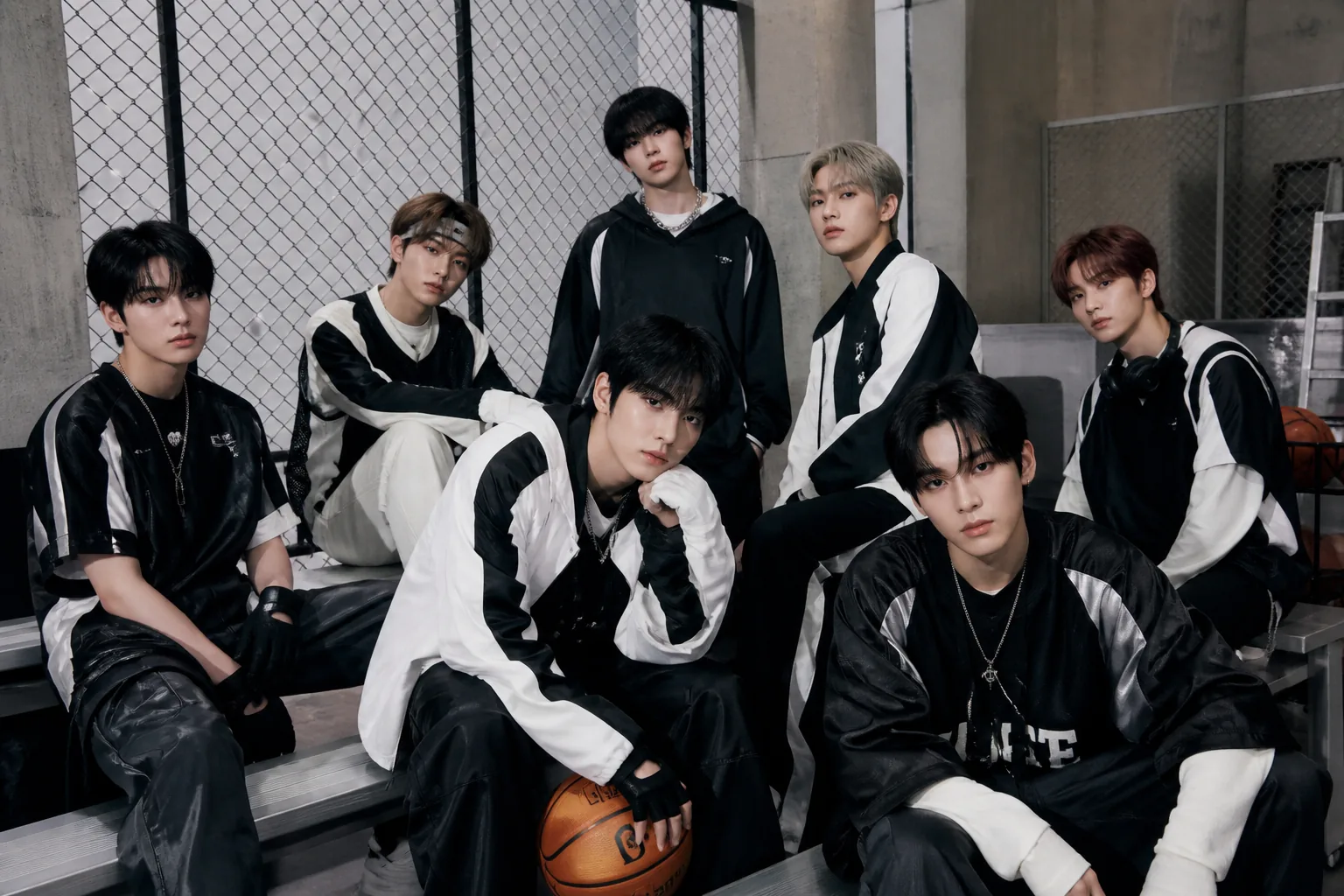 Editorial visual of a K-pop group preparing a new music release