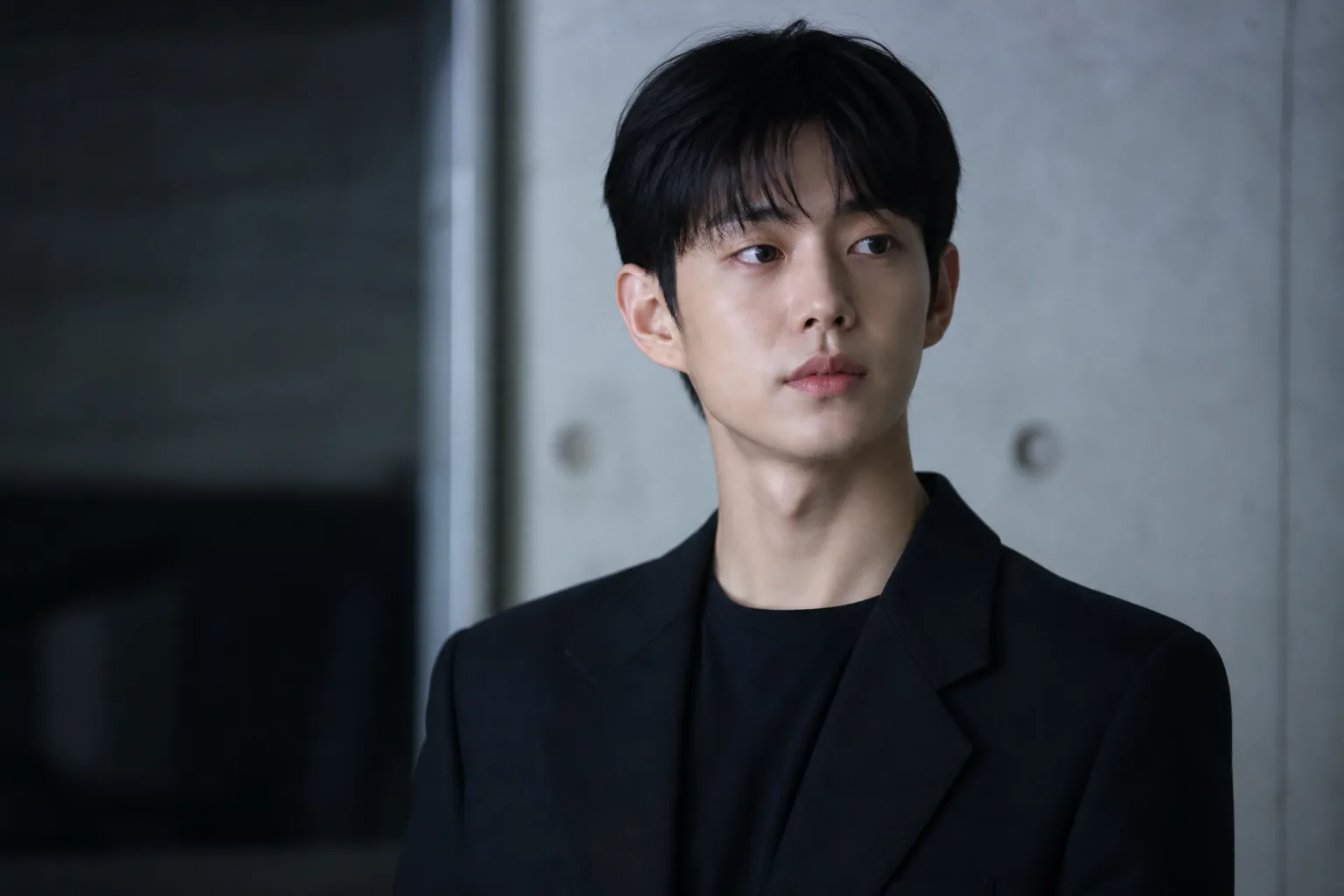 Editorial visual of stage and screen performance representing a versatile Korean actor