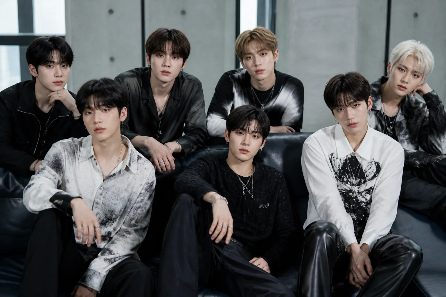 Seven performers preparing backstage before a K-pop showcase
