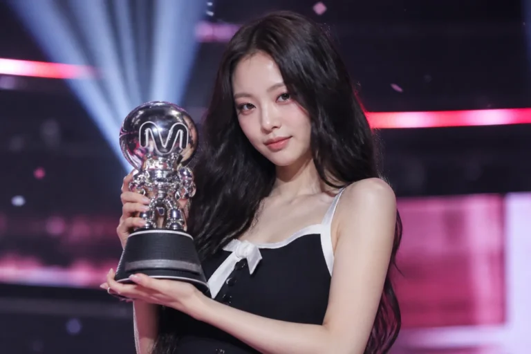 K-pop solo performer under concert lights on an editorial music-show stage