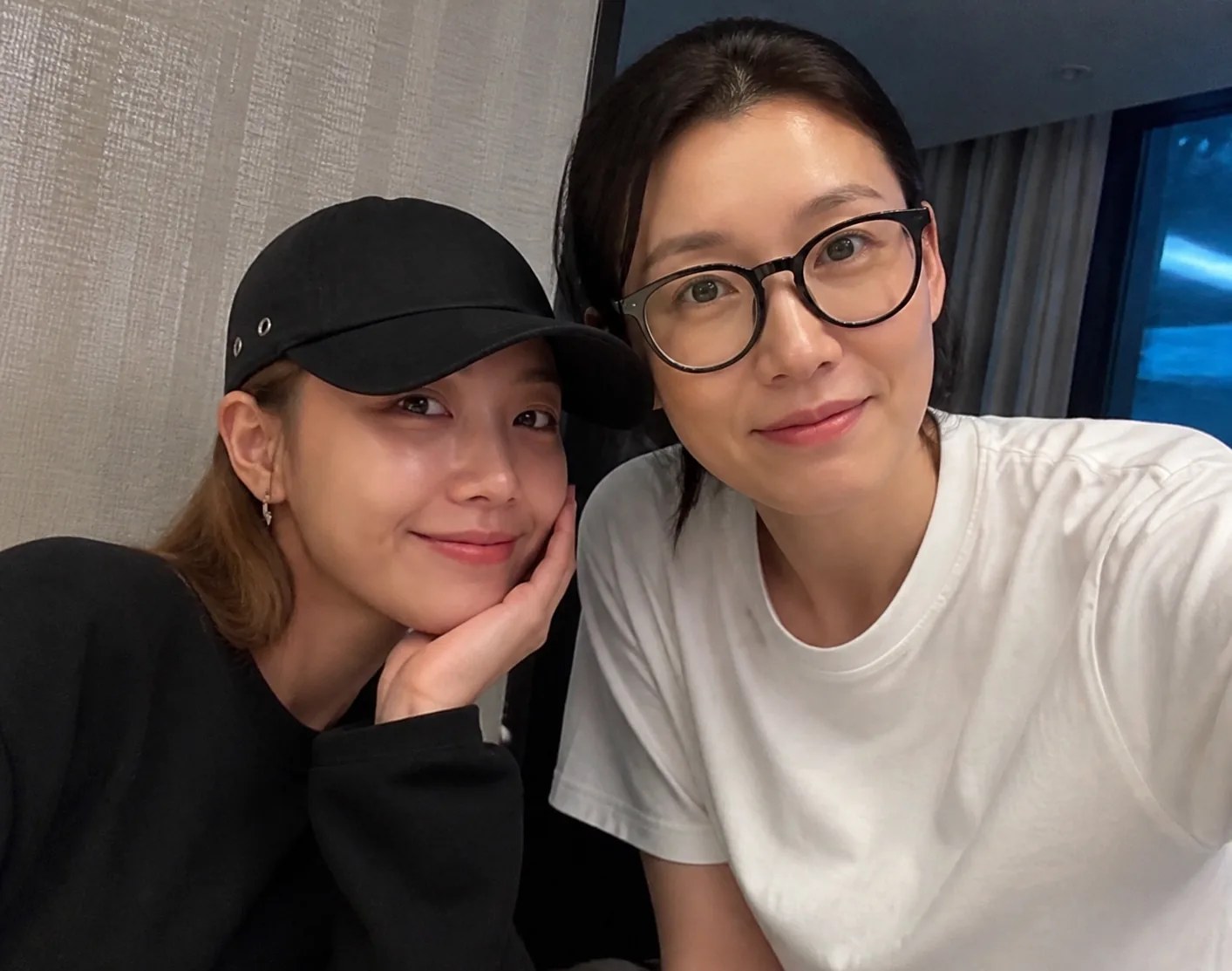 Editorial image of two Korean celebrities sharing a relaxed moment after work