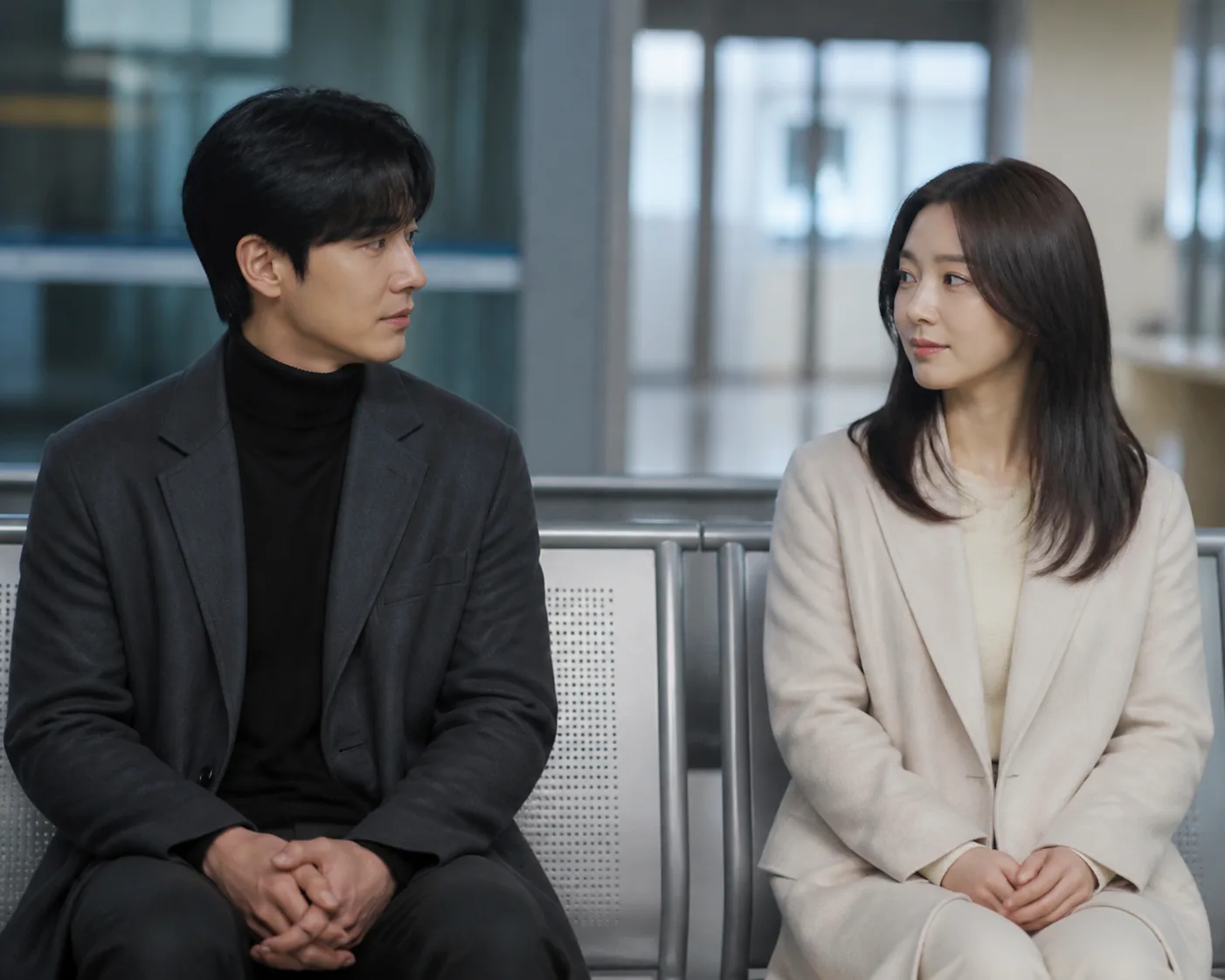 Korean drama characters sharing a reflective moment outdoors