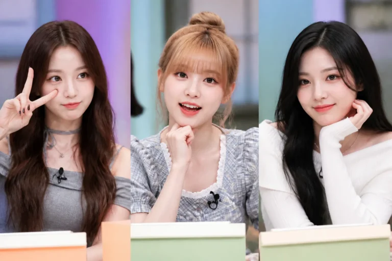 Three K-pop performers in a colorful television variety-show studio