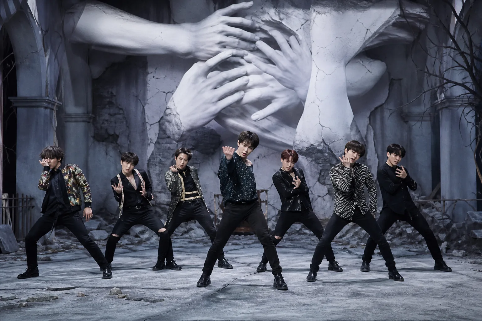 Dramatic K-pop music video set illuminated by a large online audience