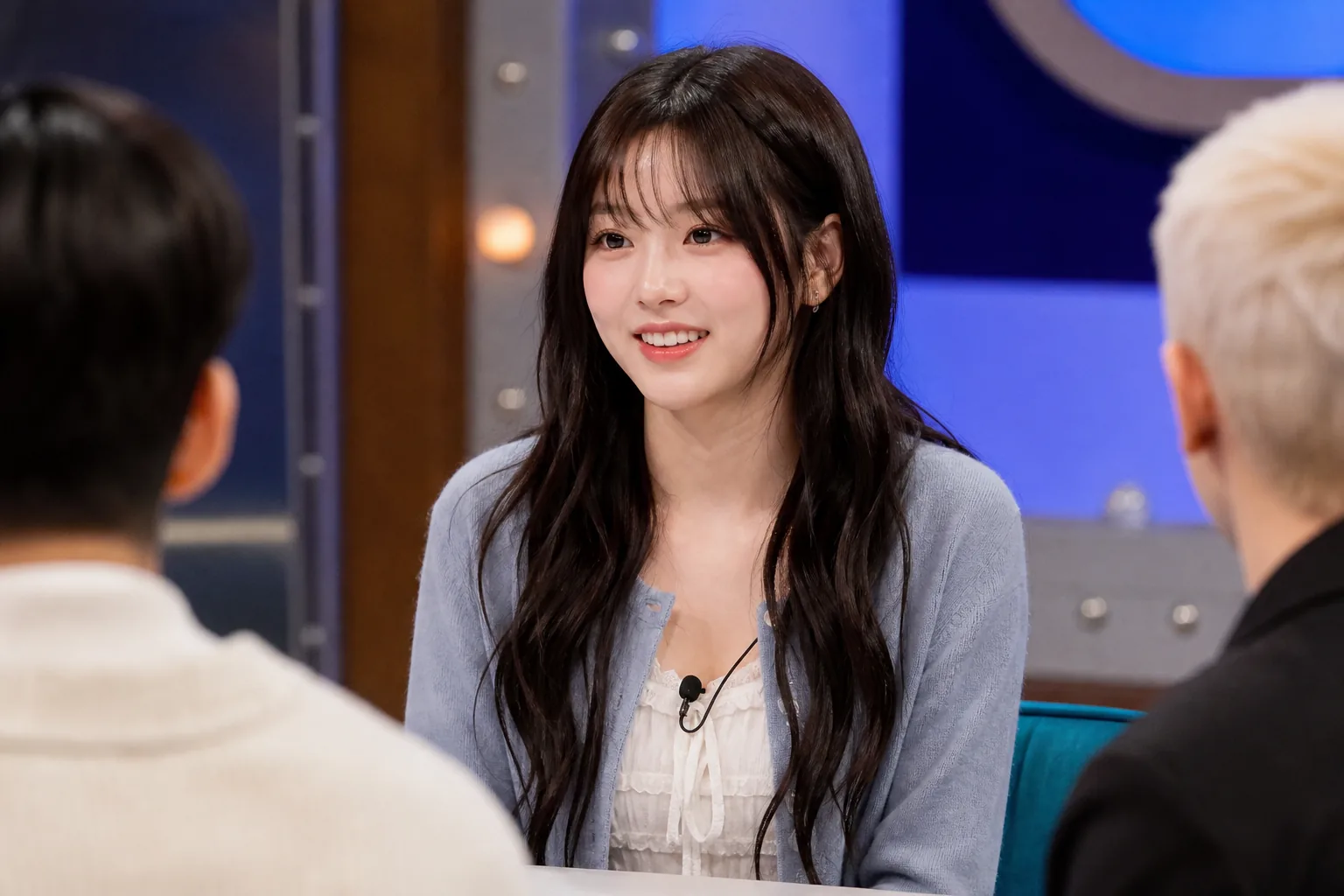 Bright variety show set representing RESCENE's appearance with senior entertainers