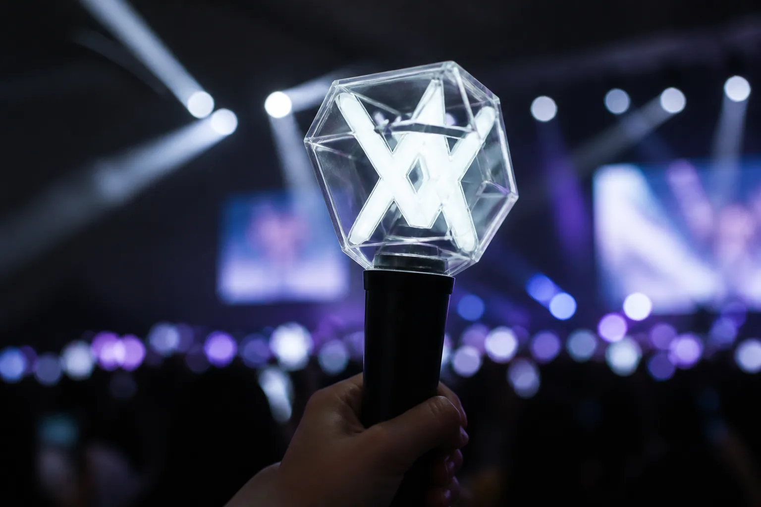 Concept sketches for a geometric concert light stick being reviewed