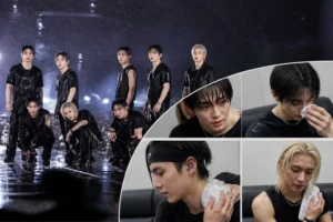Rain-soaked outdoor concert stage representing Stray Kids' Tokyo performance