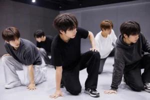 Six performers rehearsing while KickFlip member Amaru remains on a health hiatus