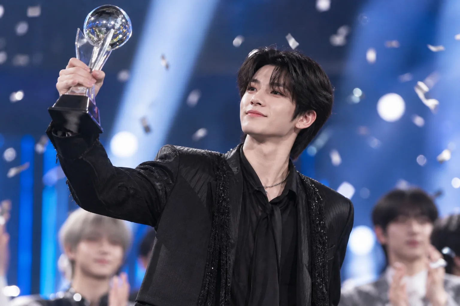 Solo performer celebrating a first music show win during an encore