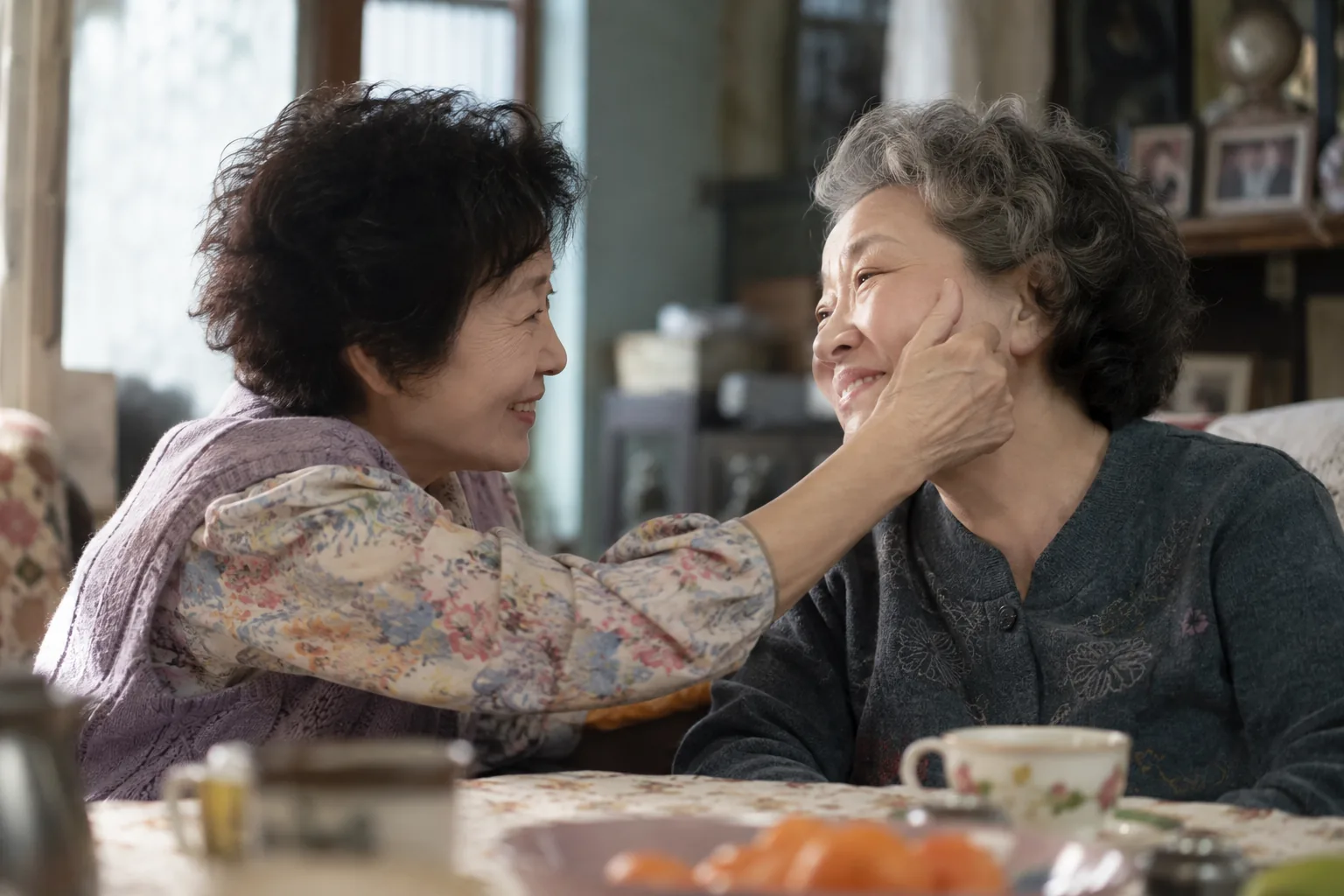One elderly friend supporting another through gradual memory loss