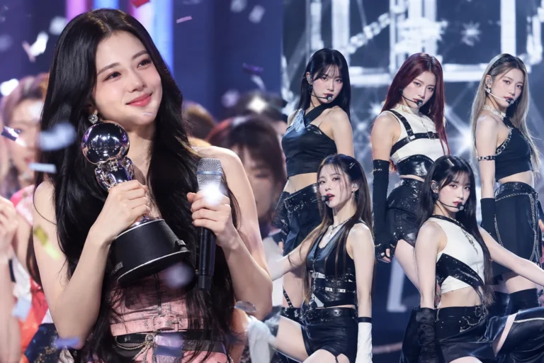 K-pop music show stage celebrating a weekly trophy win