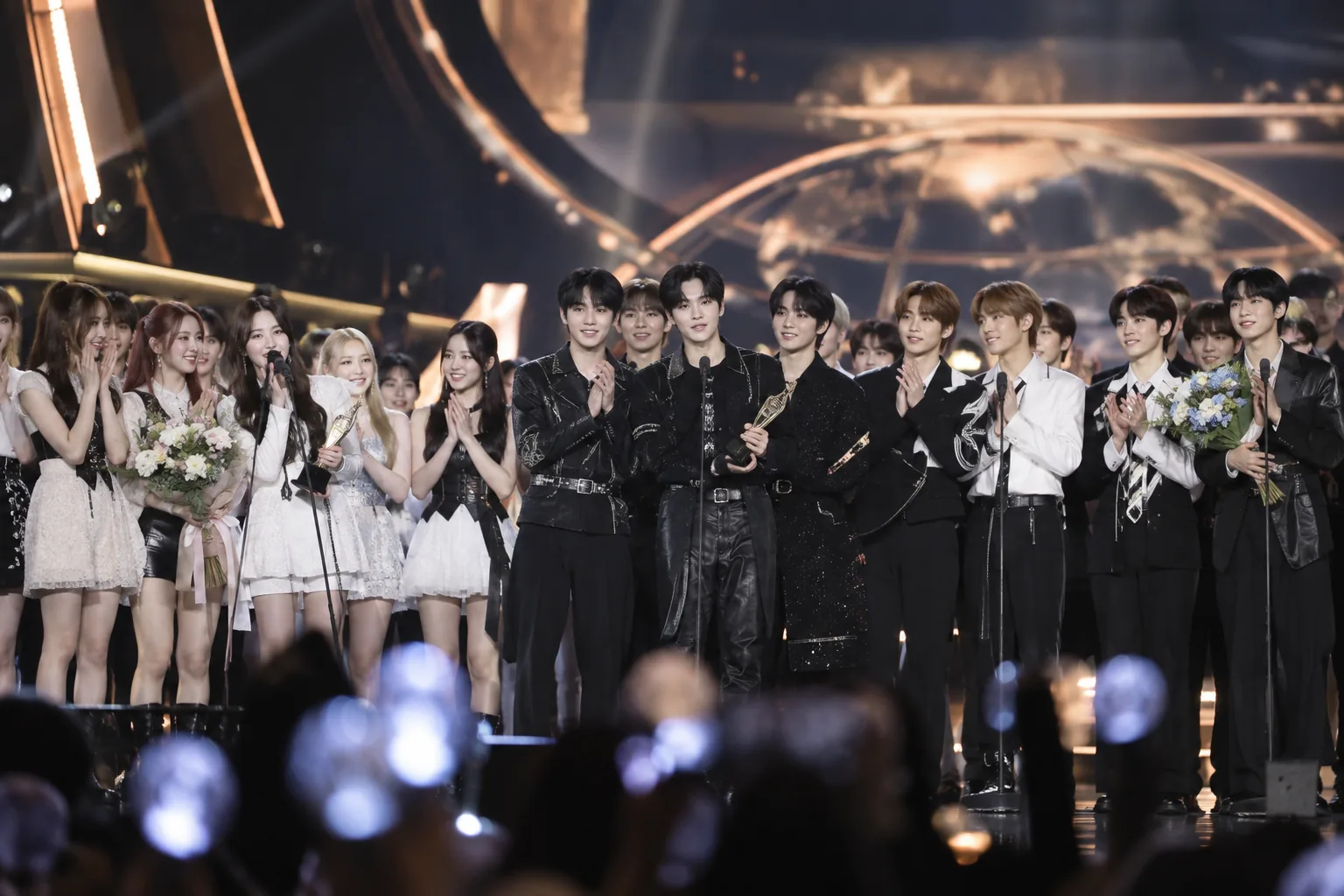 Four trophies representing the grand prize winners at the 2026 The Fact Music Awards